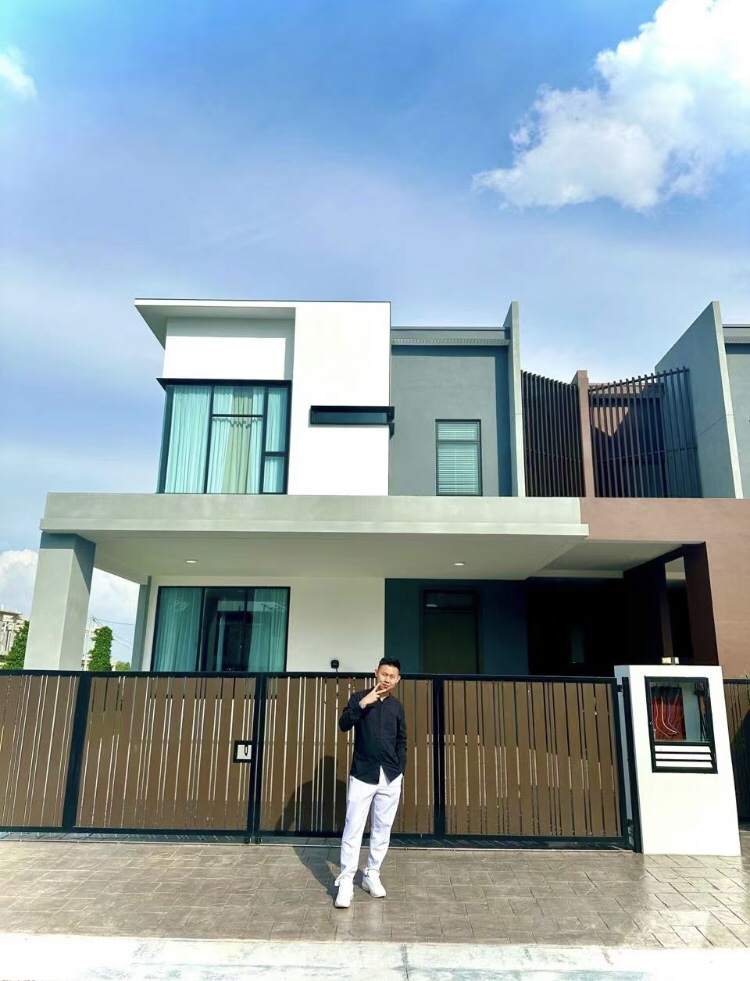 Js lim poses in front of semi-d he bought for his parents