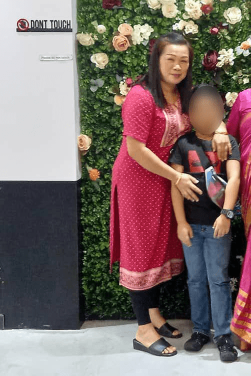 Juananey Samlin posing with her son