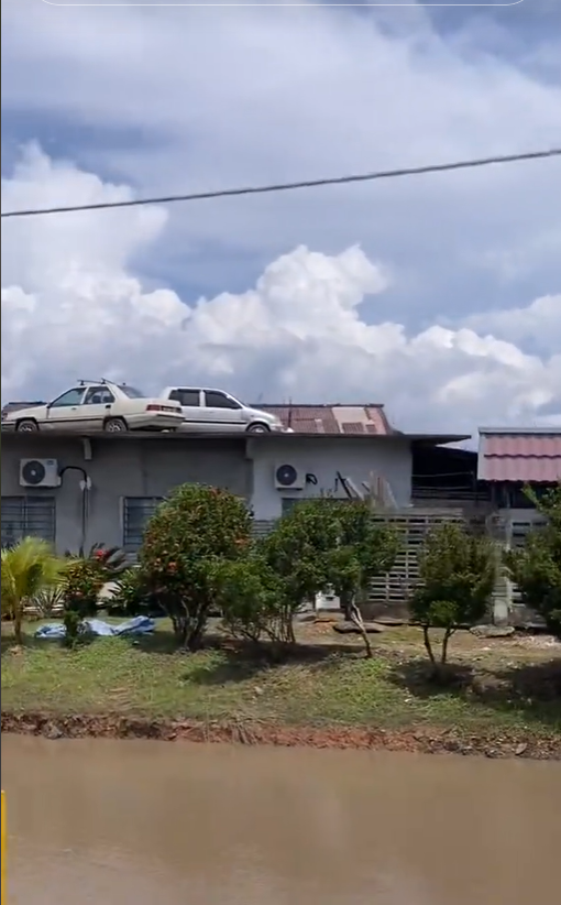 Kancil and saga parked on top of car roof