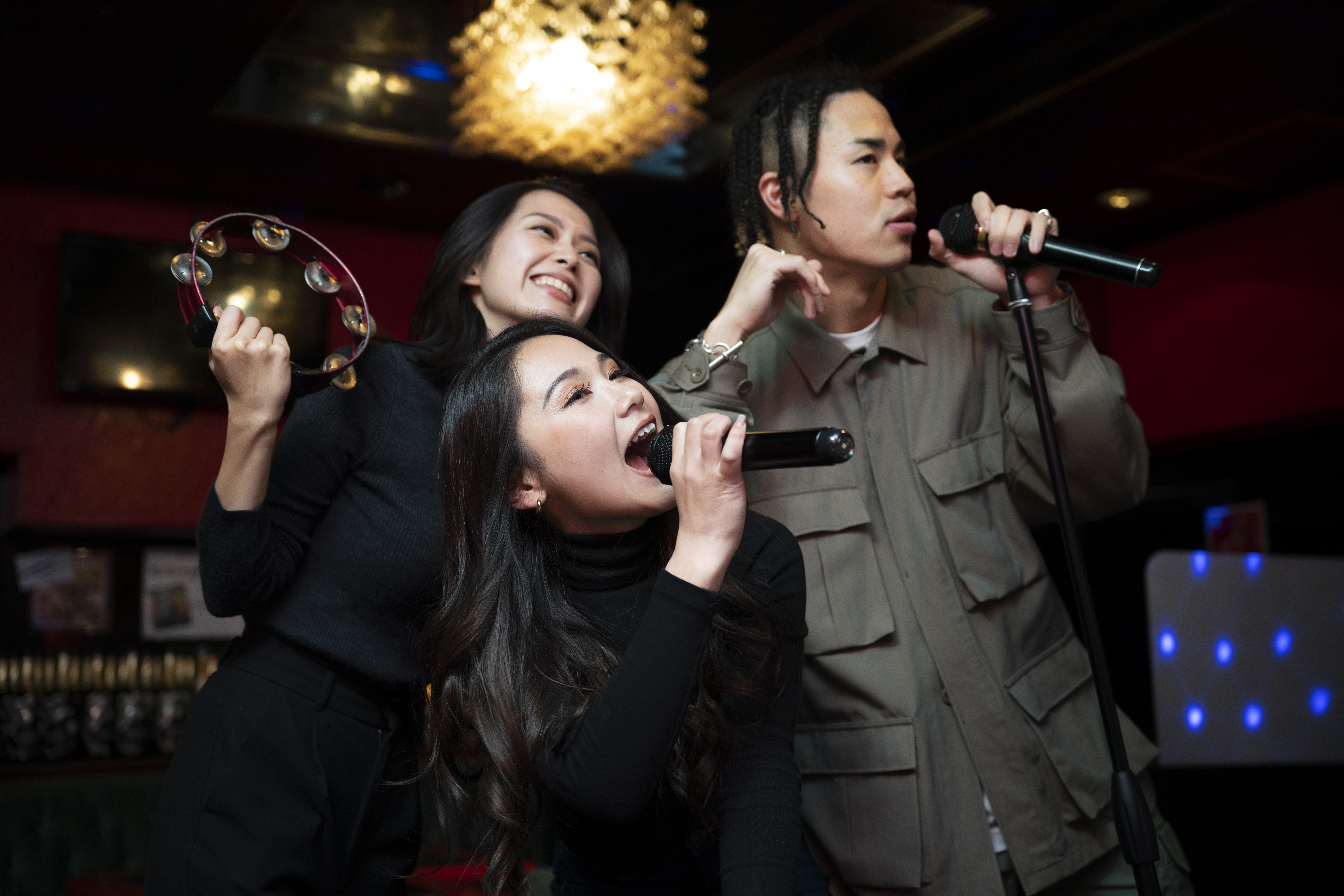 Teens having a karaoke session