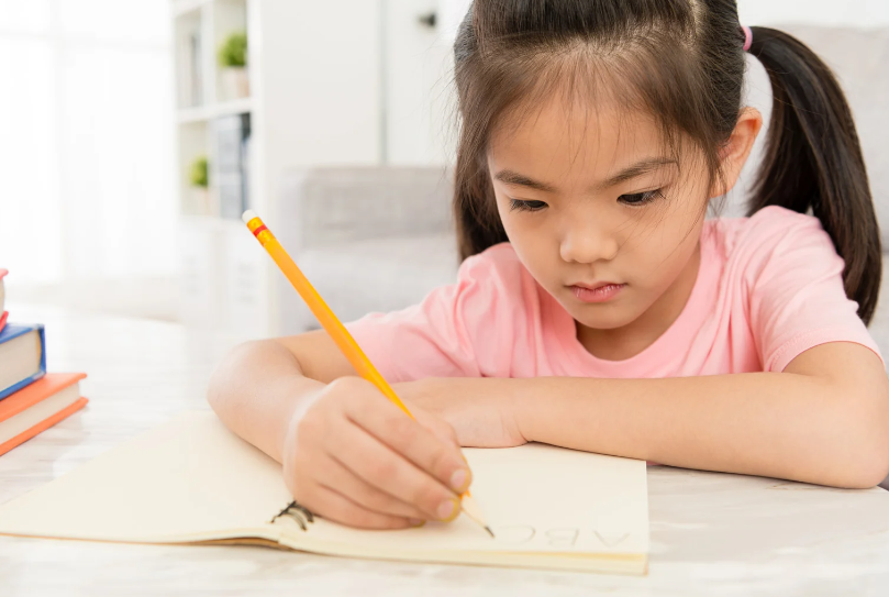 Kid writing notes