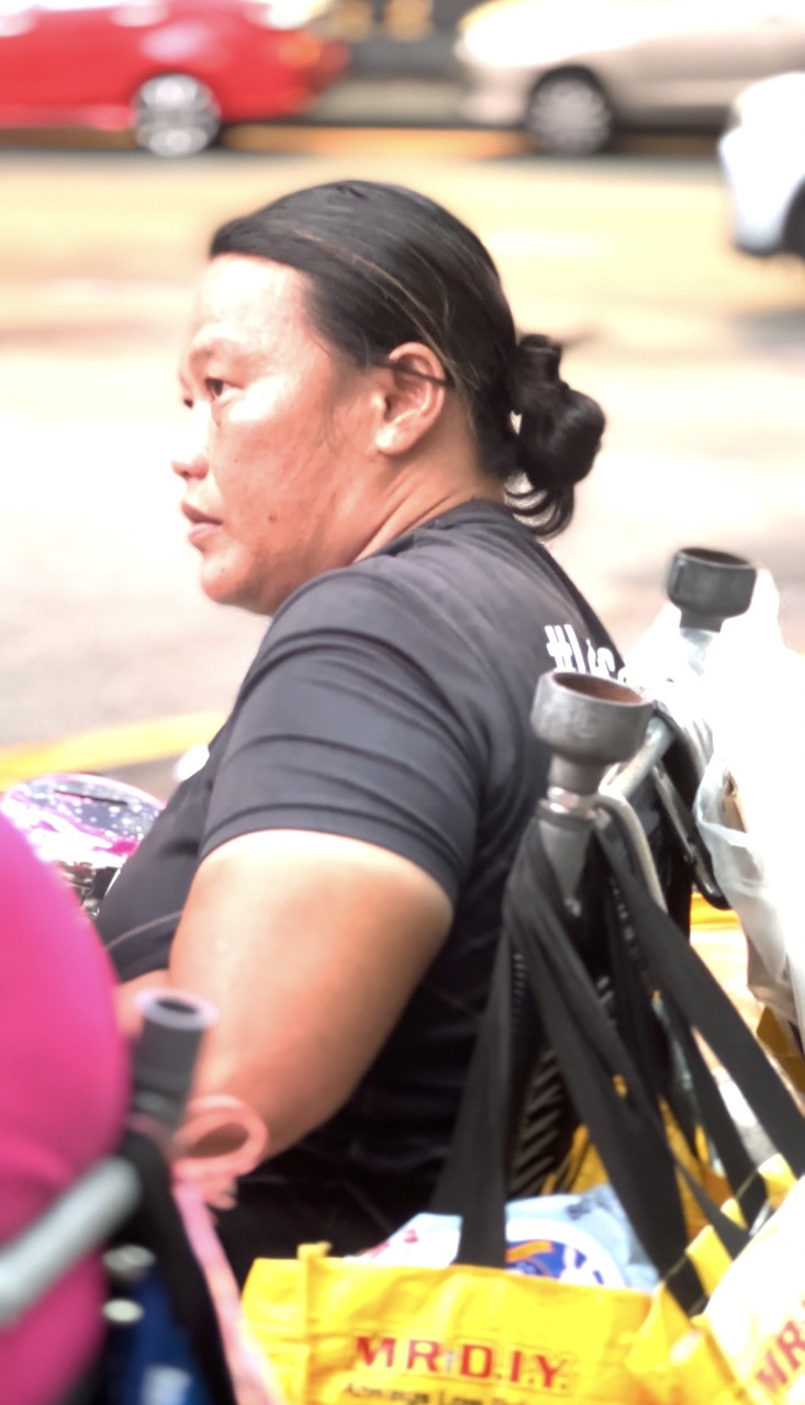 Koh lee peng sitting in her wheelchair