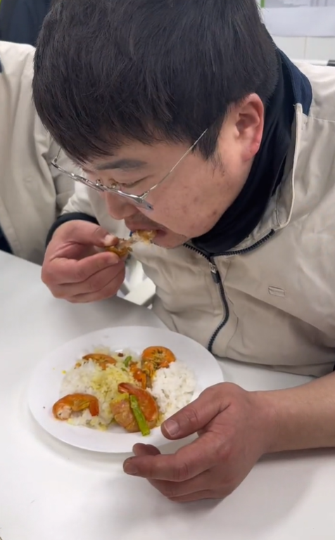 Korean man eating rice with his hands