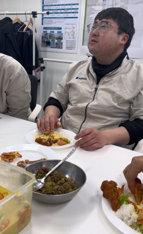 Korean man eating with his hands