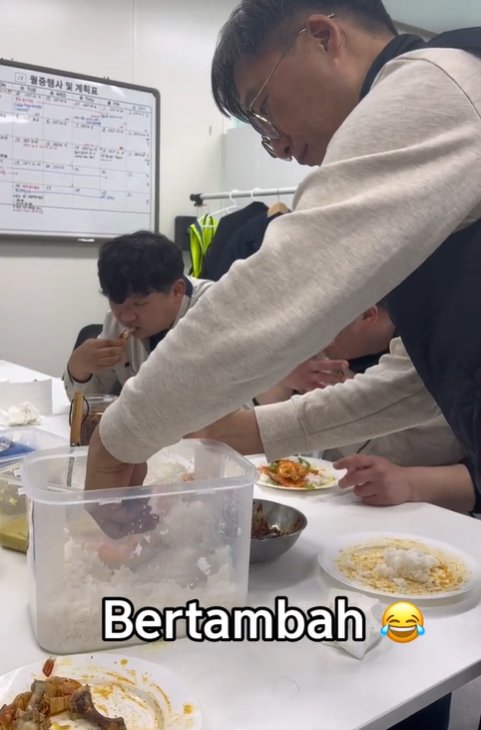 Korean man going for second helping of rice