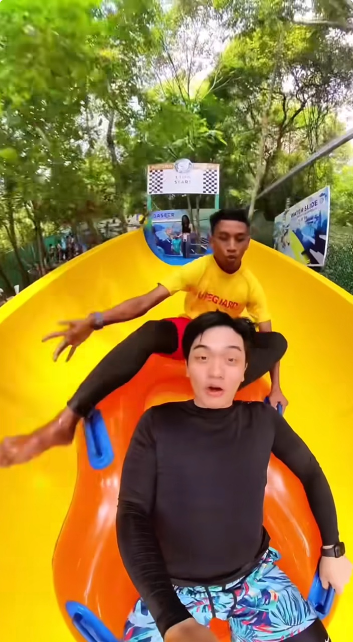 M'sian lifeguard accidentally joins man on water slide ride after he lost his footing