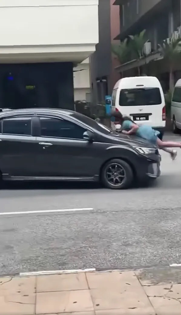 M'sian woman fakes getting hit by a car following argument with partner