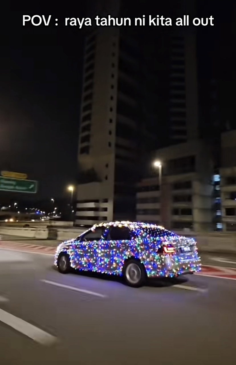 Car covered with decorative lights on the road