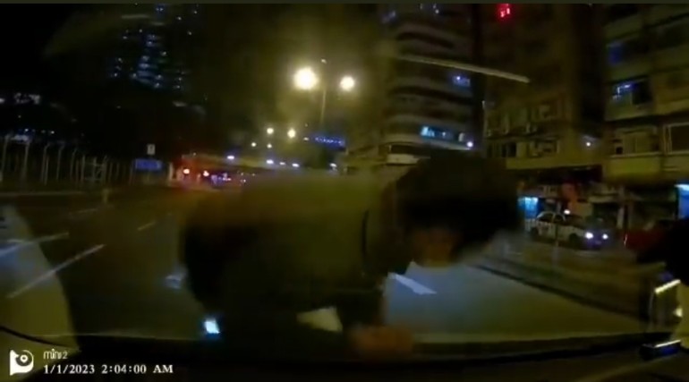 Hong kong man fakes being hit by car and rolls around on the ground dramatically for 2 minutes