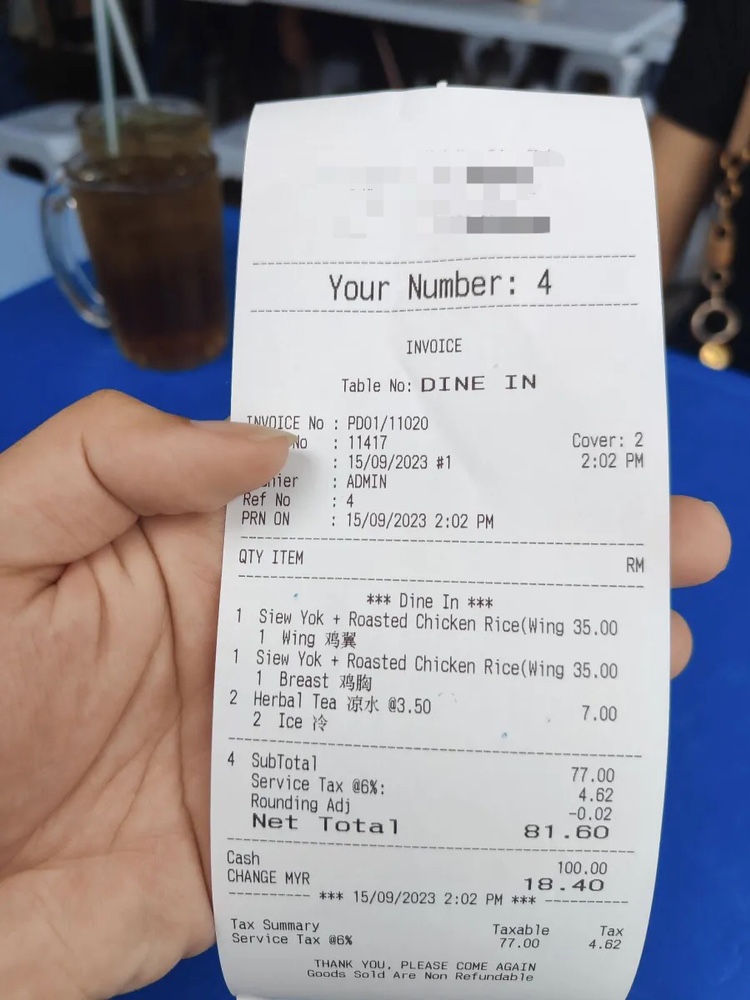 Msian shows a receipt for food that he bought at a food stall.