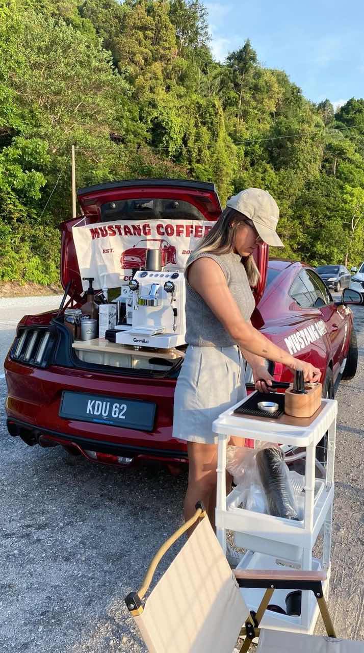 Rochelle making coffee at their roadside coffee shop