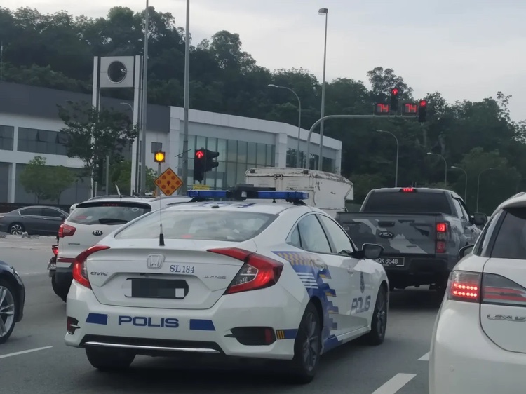 M'sian police car on the road
