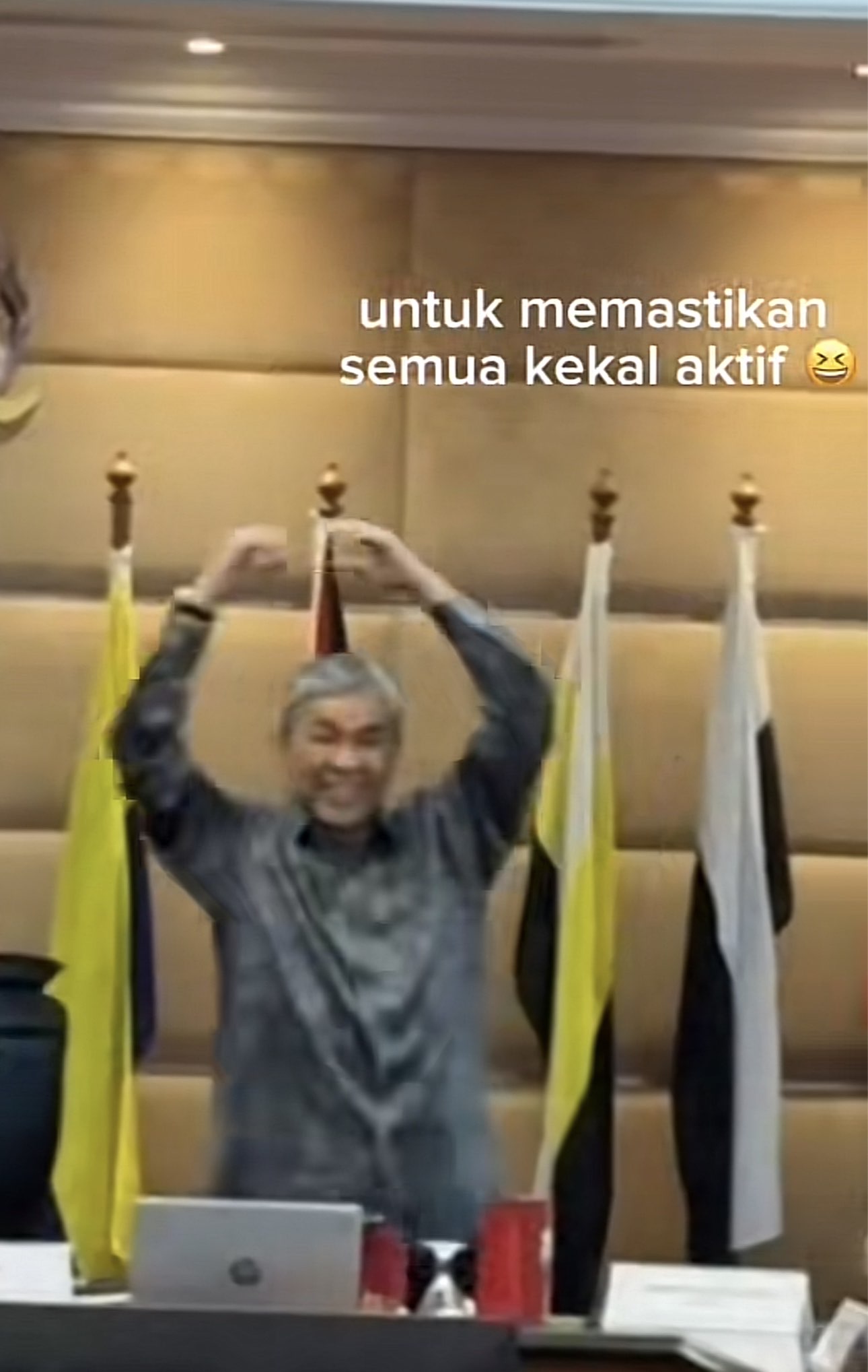 Zahid dancing forming a heart using his hands