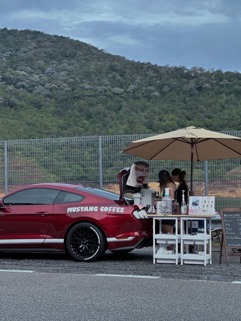 Rochelle and leah making coffee in the back of their mustang