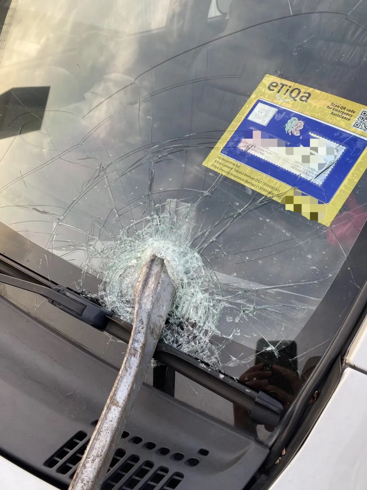 M'sian woman left shaken after metal pole pierces right through her car windshield