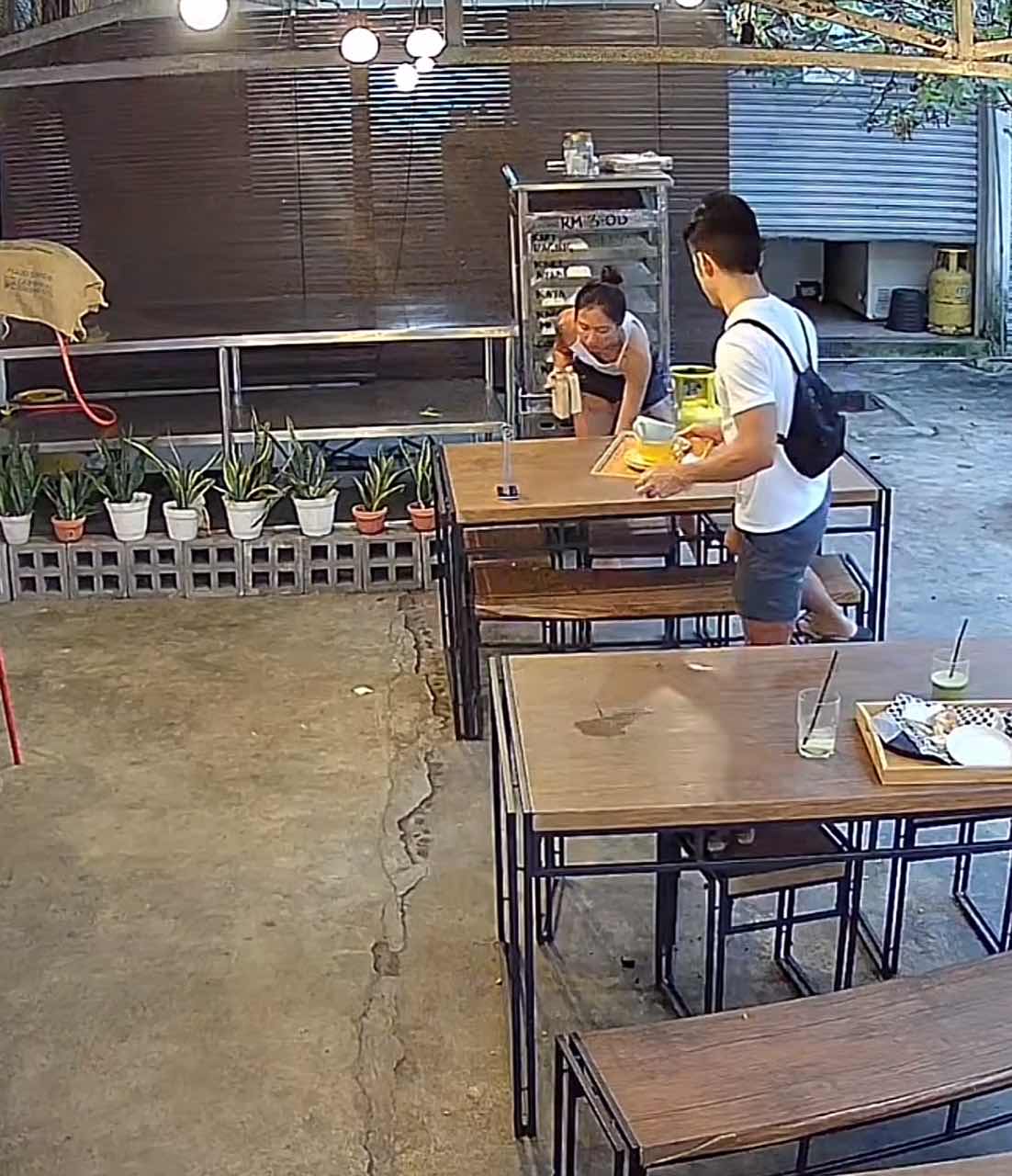 Sg couple cleaning the other table's dishes