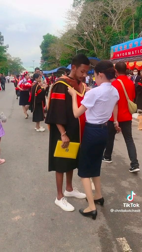 Thai woman bows before her brother's feet to thank him for giving up his education for hers