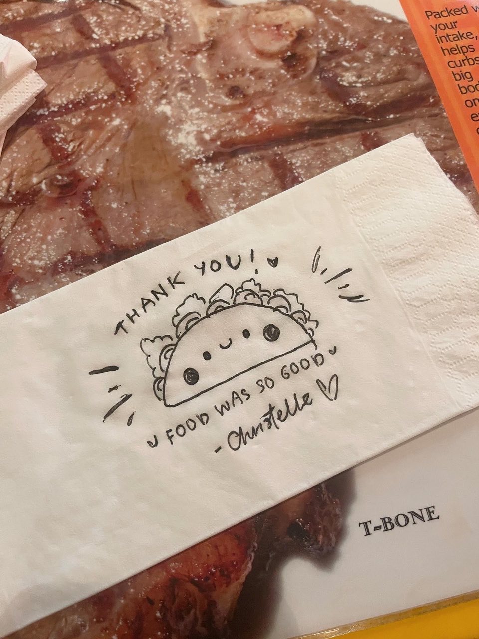 A doodle of a steak done in a piece of tissue