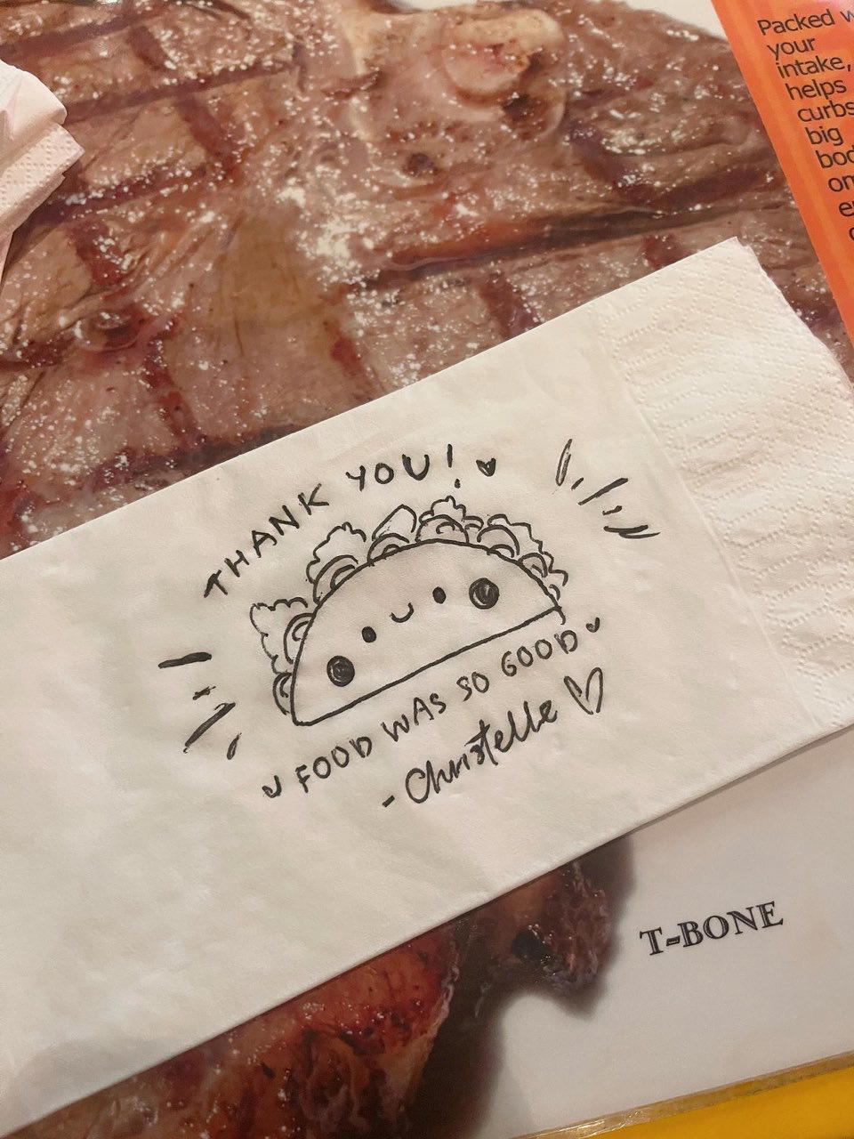 A doodle of a steak done in a piece of tissue