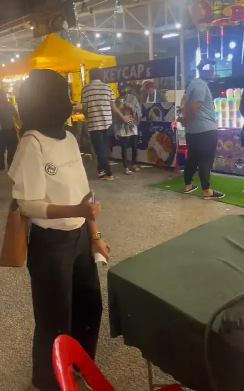 M'sian woman shows 'signal for help' at pj fair, police save her from bf who was allegedly abusive