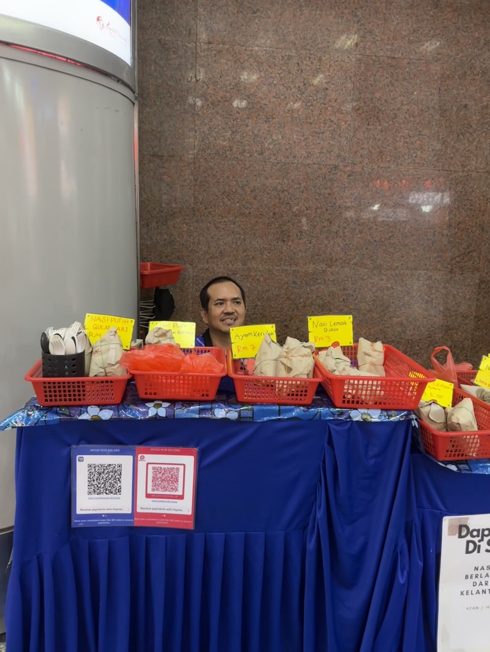 Mohd selling nasi lemak near nu sentral entrance