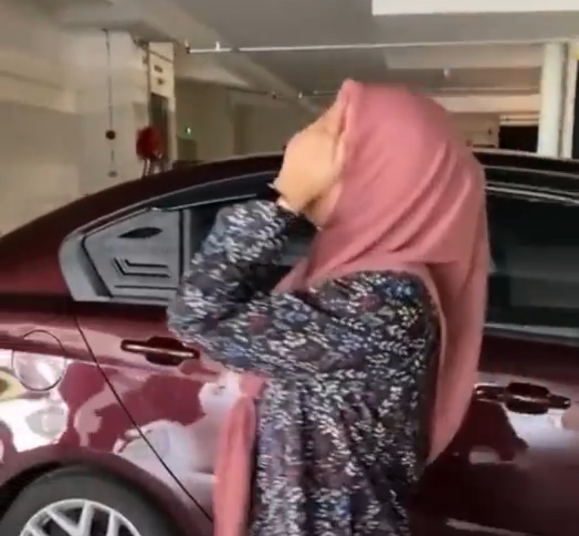 M'sian teen drives perodua axia onto divider while leaving carpark, says she didn't notice it at all