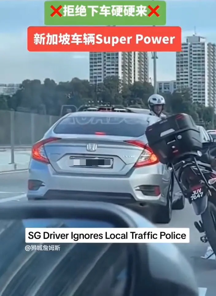 Sg-registered car ignores m'sian police officer and drives on despite being told to stop
