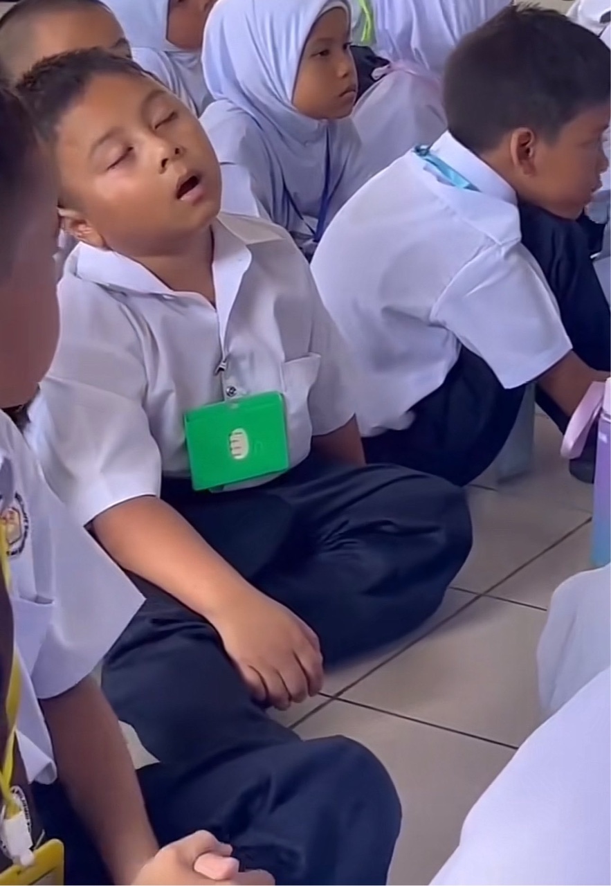 Boy falling asleep in assembly