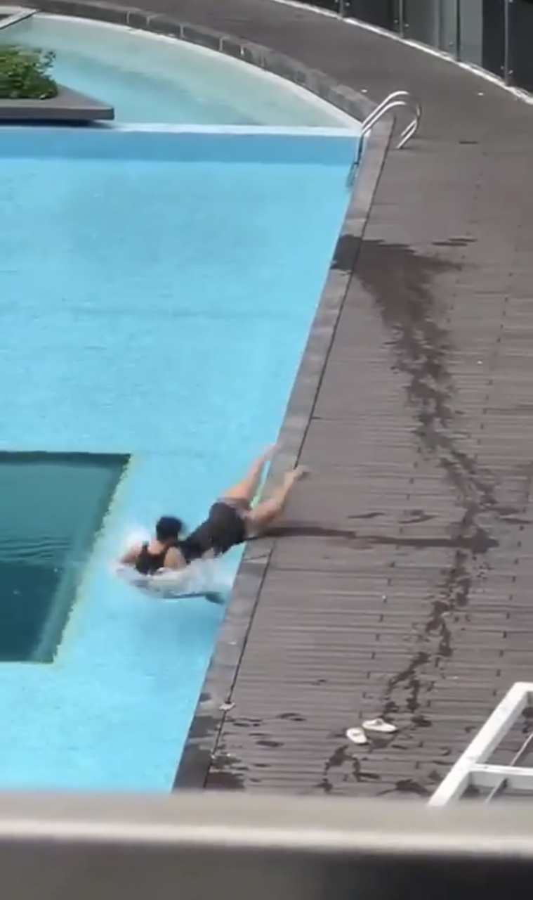 Gf who is allegedly pregnant, falls in the pool after being dragged by her bf