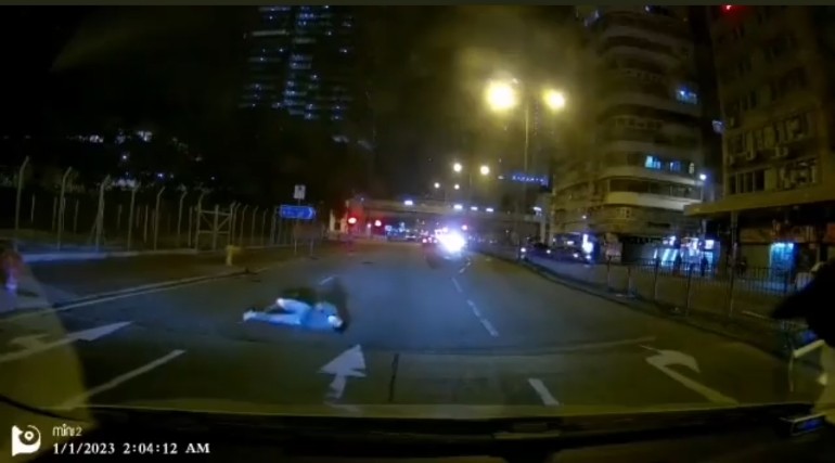 Hong kong man fakes being hit by car and rolls around on the ground dramatically for 2 minutes