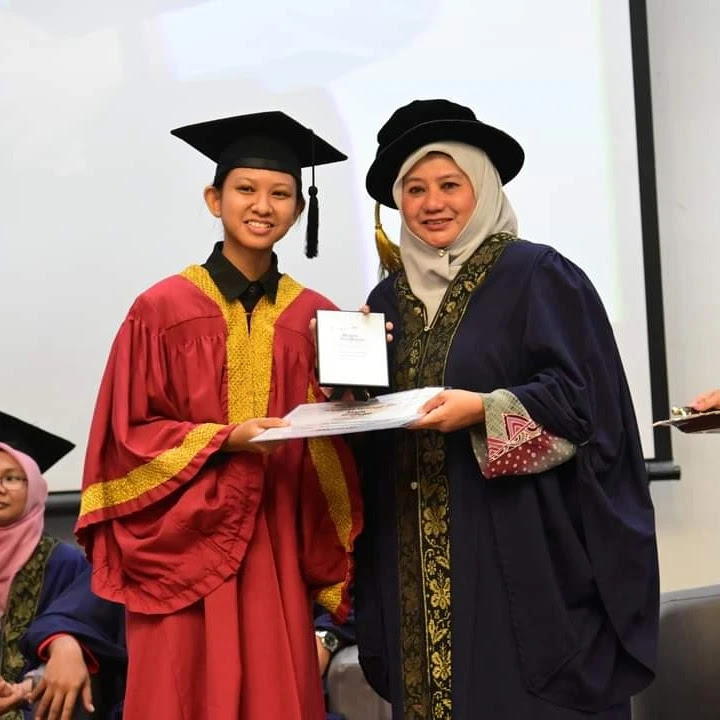 Leia with her teacher at Permata