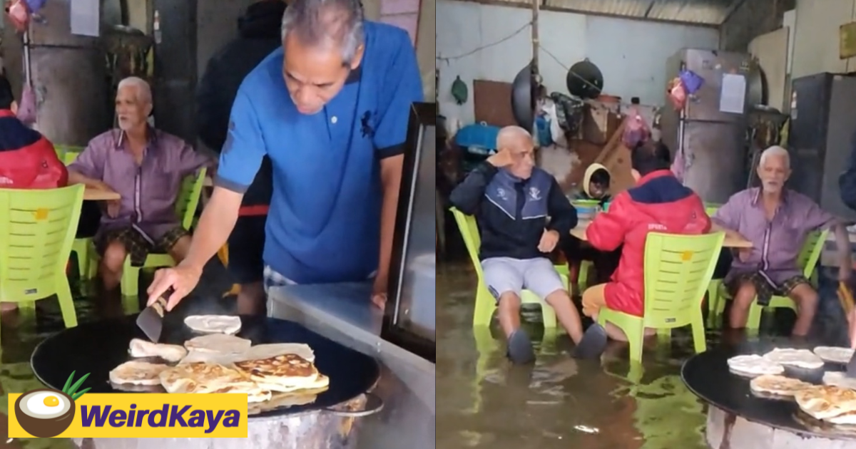 M'sian roti canai seller carries on business despite being in knee-deep water | weirdkaya