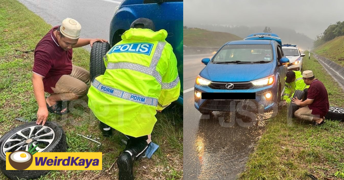 M'sian police officers praised for assisting stranded motorist with flat tire during heavy rain | weirdkaya