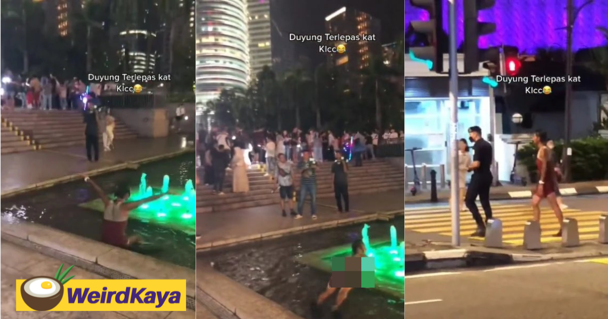 Woman in a short dress swims inside water fountain near klcc, bystanders yell ‘out! ’ at her | weirdkaya