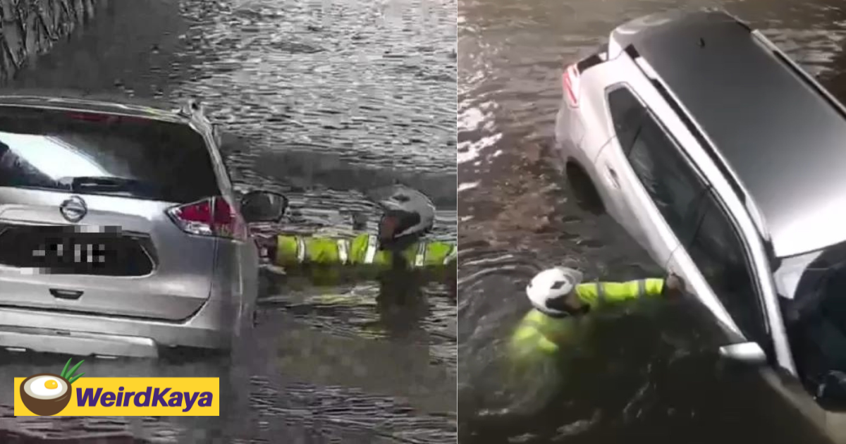 3 m'sian traffic police risk their lives to rescue driver trapped in flash flood | weirdkaya