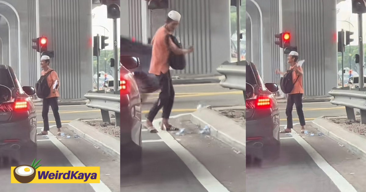 Mentally unstable man spotted angrily throwing his money on the road at traffic light | weirdkaya