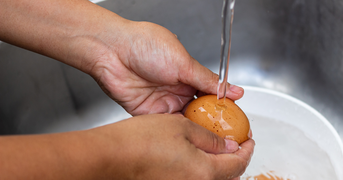 Washing egg under water