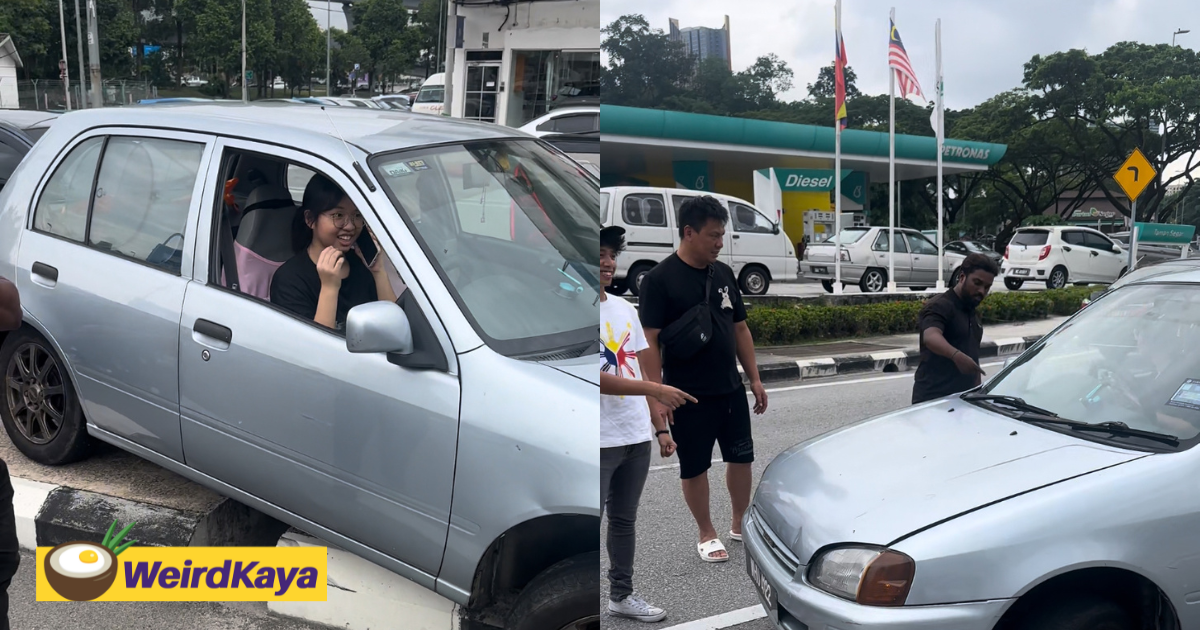 M'sian p-license driver seen smiling even after car gets stuck on road divider | weirdkaya