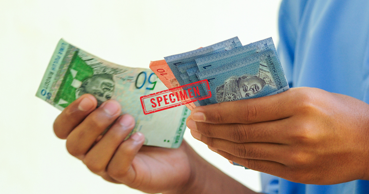 Ringgit notes in hand
