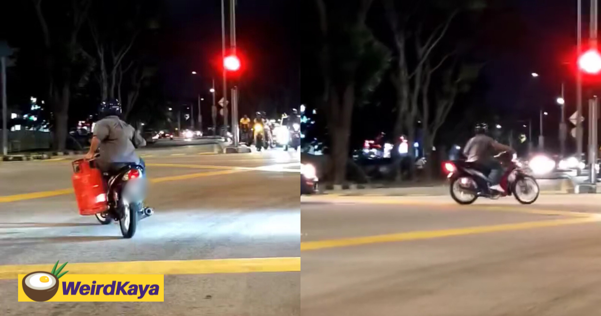 M'sian motorcyclist rides through traffic at night holding gas cylinder with one hand | weirdkaya