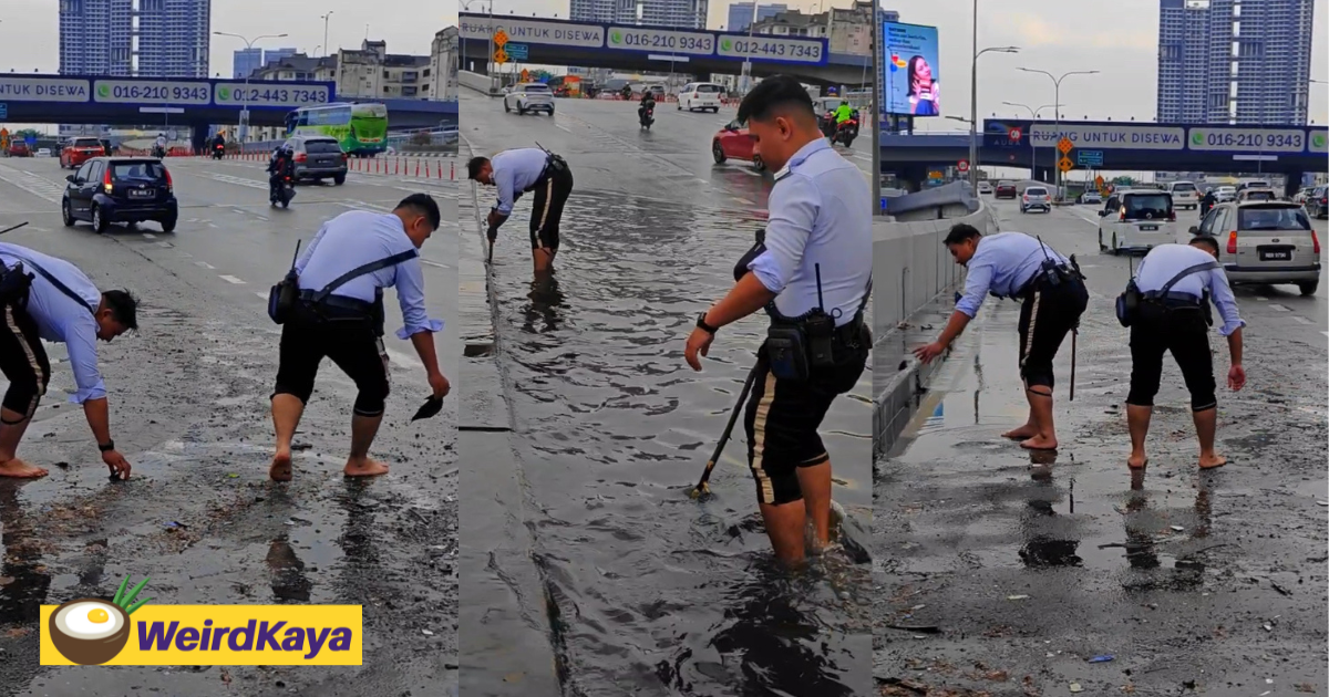 M'sian traffic police officers go beyond their duty by clearing clogged drains while barefoot | weirdkaya