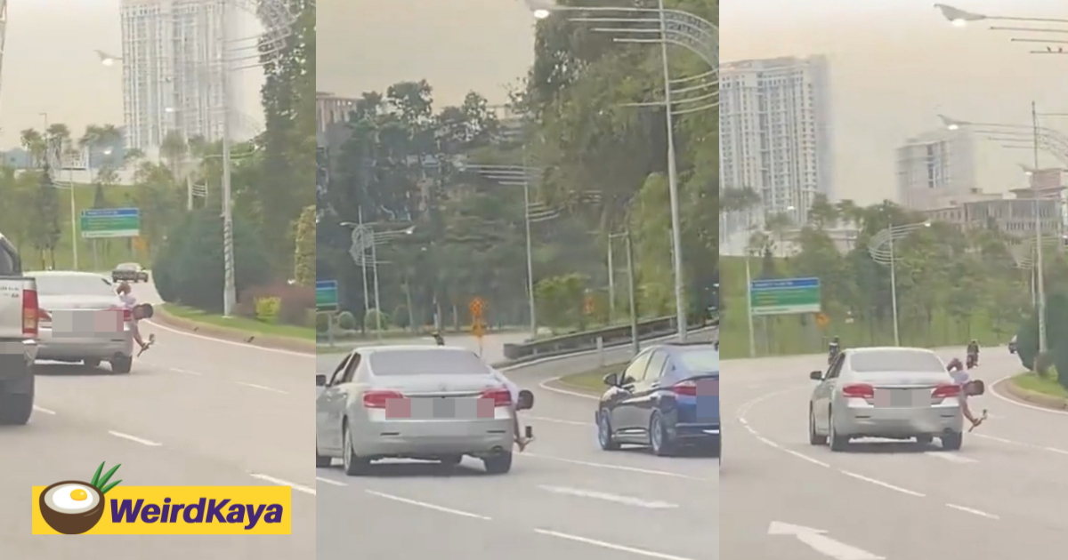 M’sian man leans out of moving car to film another car on the road | weirdkaya