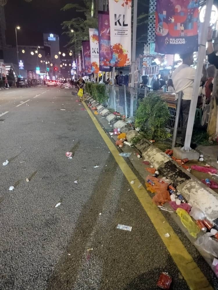Rubbish being thrown along the streets of kl after new year celebration