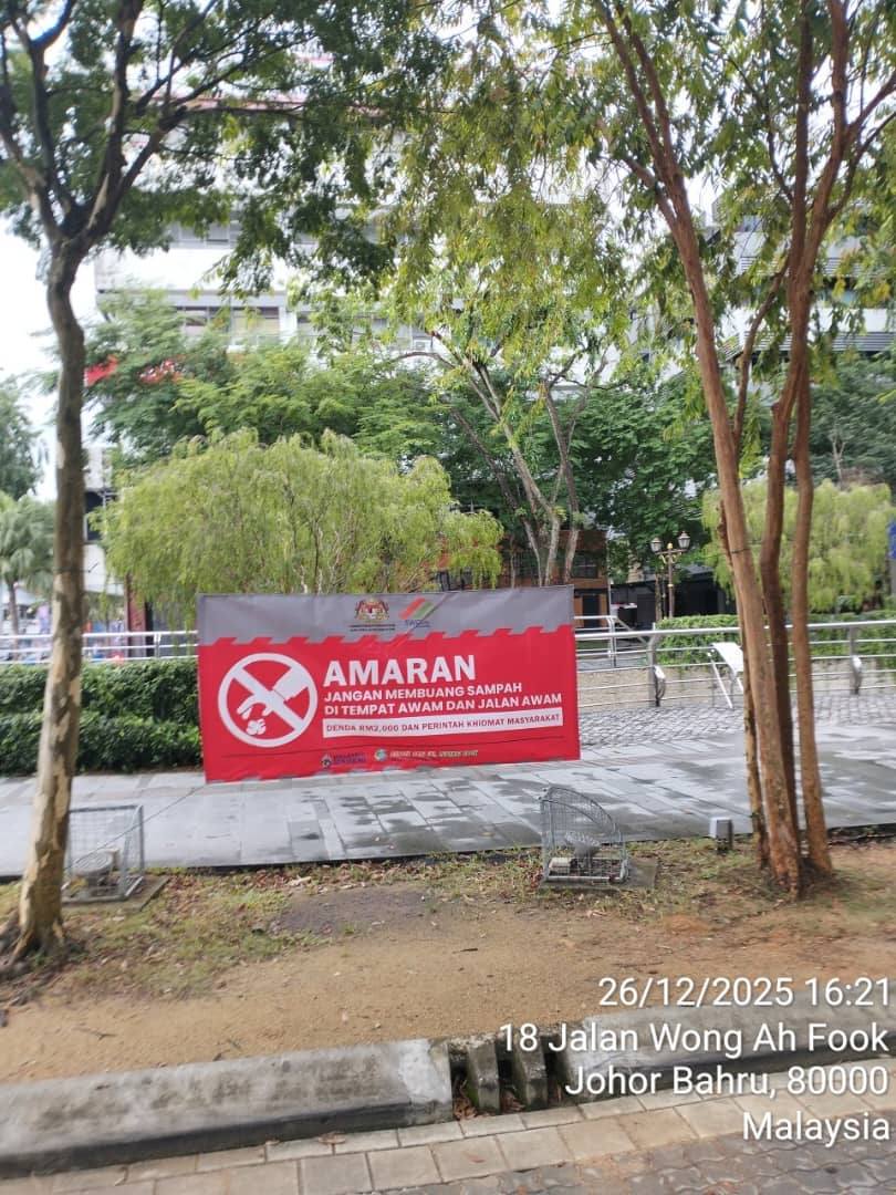 Littering warning poster in JB