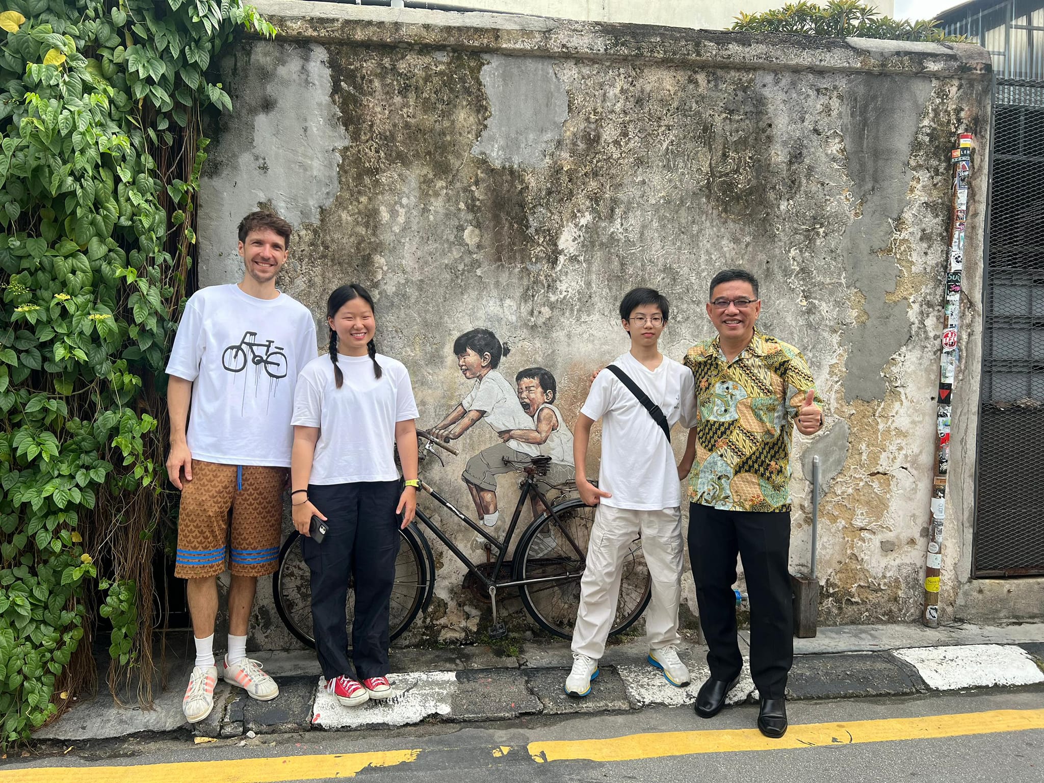 Little children on a bicycle mural