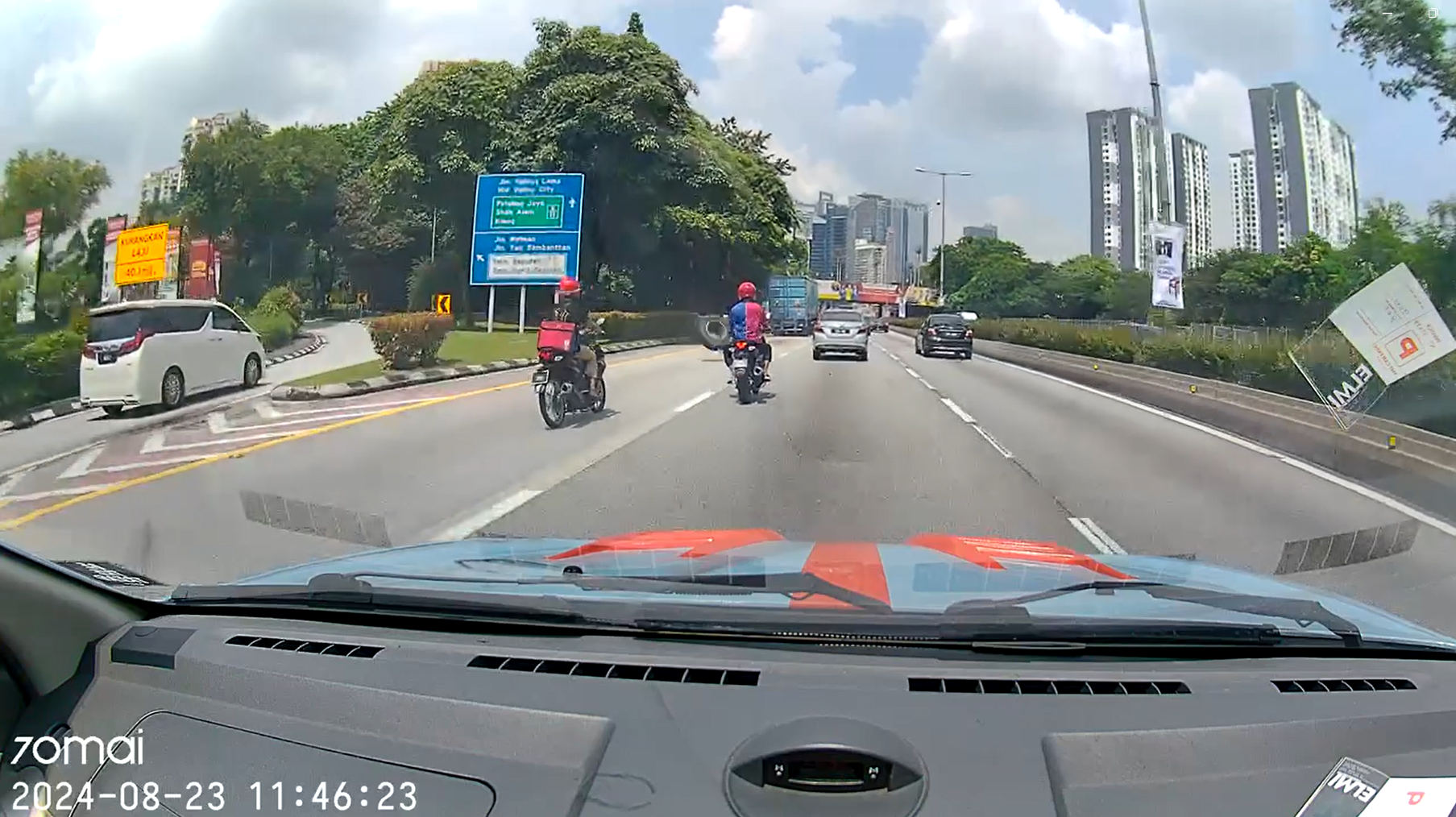 Lorry tyre flying towards m'sian man