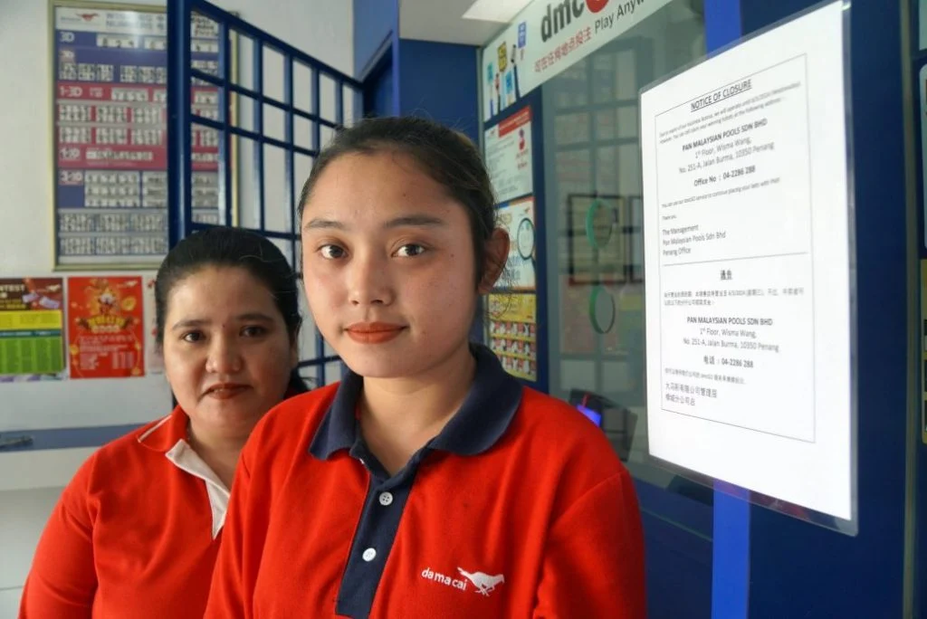 Two workers of last lottery outlet in perlis