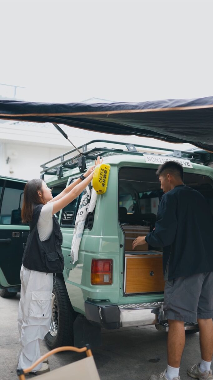 Nik and jing setting up their van coffee