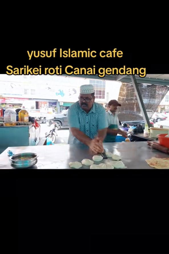 M'sian man beating roti canai rhythmically