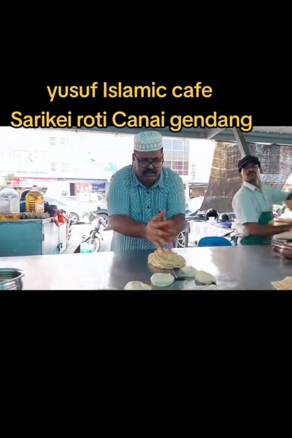 M'sian man beating roti canai rhythmically